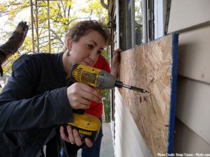 Boarding up windows before a hurricane boynton and boynton